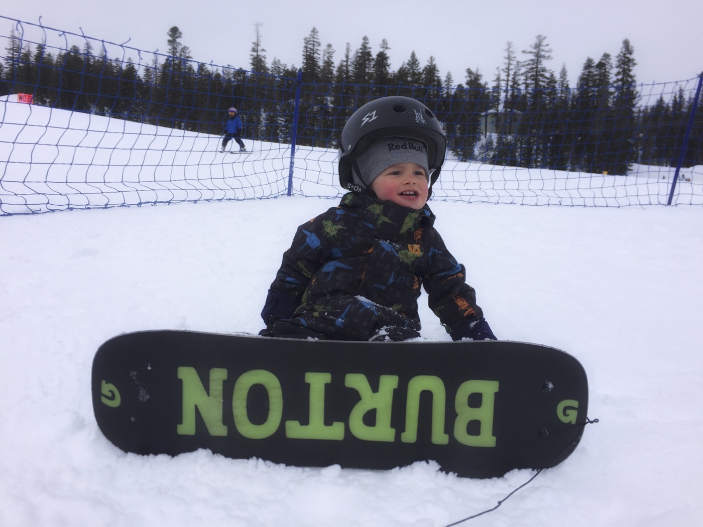 Young rider on a Burton snowboard